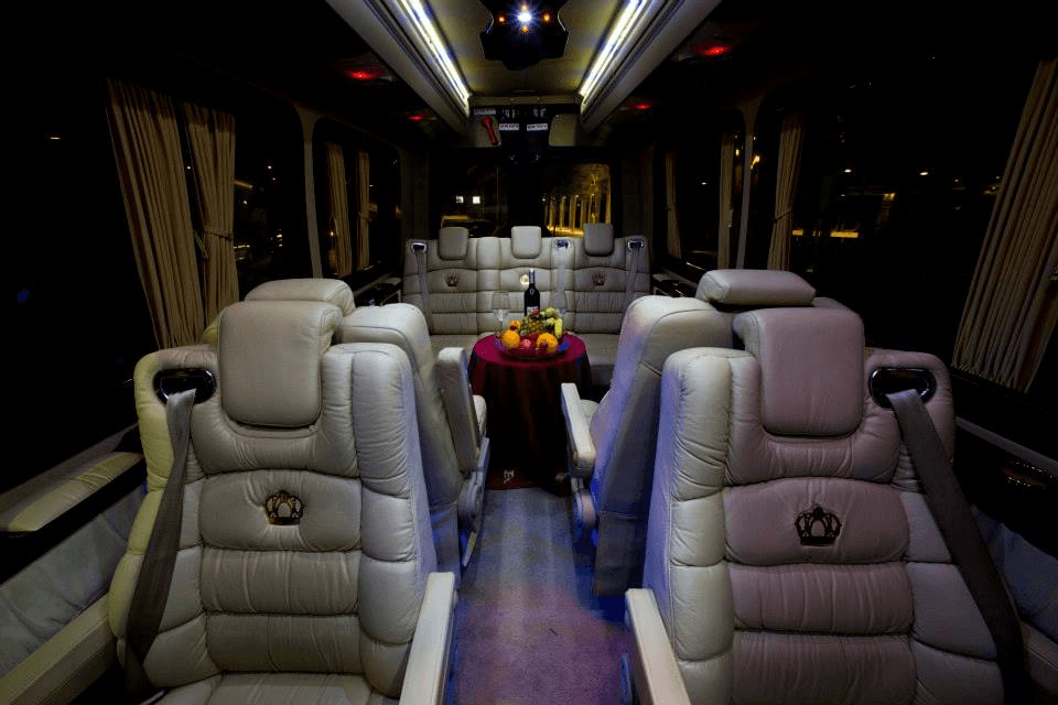 Spacious luxury van interior with leather seating and onboard refreshments